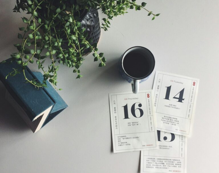 a cup of coffee sitting on top of a table
